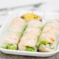 Spring Rolls · 3 rolls.
Rice paper wrapped lettuce, herbs, cold noodle, and shrimp or tofu