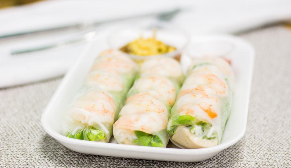 Spring Rolls · 3 rolls.
Rice paper wrapped lettuce, herbs, cold noodle, and shrimp or tofu