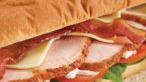 Turkey Breast Sandwich · Includes lettuce, tomatoes, onions, mayonnaise, and potato chips.