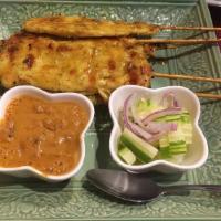1. Chicken Satay · Chicken skewered and marinated in coconut milk and Thai spices, char-broiled. Served with pe...