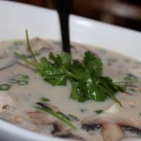 Tom Kha · Hot and sour, coconut milk, lemon grass, fresh mushrooms, red onions and galangal.