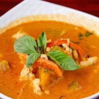 Pumpkin Curry · Red curry with pumpkin, red bell peppers and fresh basil. Tofu and vegetable.