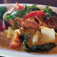 Choo Chee Pla Curry · Fried Atlantic salmon fillet in red curry with cabbage, broccoli, red bell reppers, napa and...