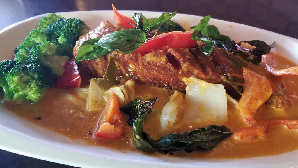 Choo Chee Pla Curry · Fried Atlantic salmon fillet in red curry with cabbage, broccoli, red bell reppers, napa and carrots.