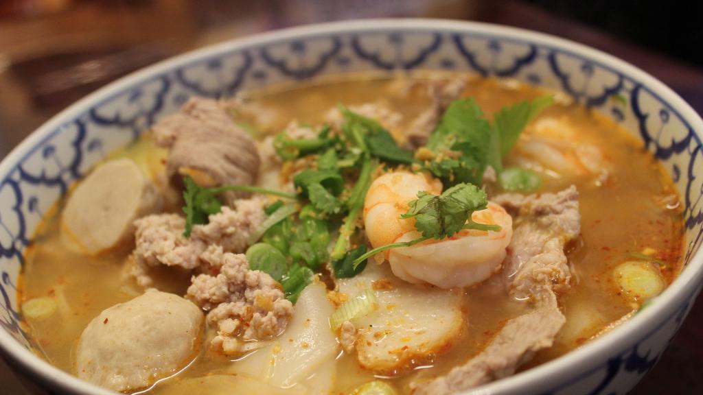Tom Yum Noodle Soup · Hot and spicy noodle soup served with ground pork, sliced pork, pork balls, shrimp, fish cake and ground peanuts.