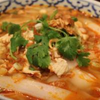 Kao Soy Laos Noodle Soup · Laos style pork soup with wide noodle, chicken, bean sprouts and cabbage.