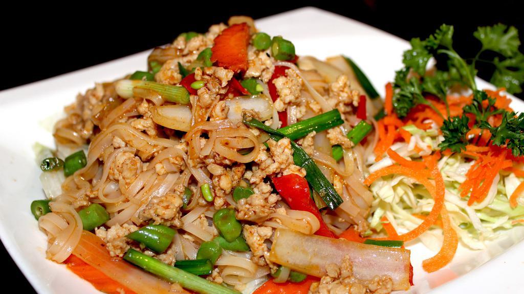 Chai Thai Noodles · Stir fried rice noodle with ground chicken, onions, diced green beans and red bell peppers.