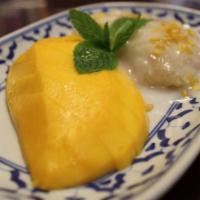 Sweet Sticky Rice with Mango · Sweet coconut sticky rice served with fresh sliced mango.