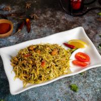 Tea Leaf Salad · A mix of Burmese tea leaves, fried garlic, yellow beans, peanuts, sesame seeds, sunflower se...