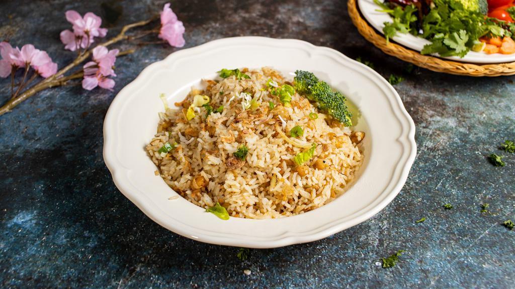 Pineapple Fried Rice · Choice of jasmine or brown rice with pineapple, green beans, carrots, egg, onions, scallions, soy sauce, and turmeric. Gluten-free.