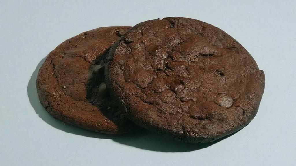Vegan Double Chocolate Cookie · No joke. These cookies are the epitome of soft, gooey, fudgy, chocolatey goodness. Double dose of fair – trade chocolate and a chewy sweet and salty dough create a beautiful marriage. Close your eyes, you would not know it was Vegan.