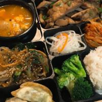Bento  Box · Choice of meat + japchae + 2 dumplings + kimchi, broccoli, radish + side of rice + choice of...