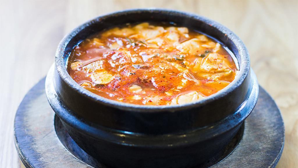 Soft Tofu Stew · Soft tofu with mushroom, zucchini, and onion. Served spicy, mild or non-spicy. Choose beef & seafood, beef, seafood, oyster, pork, chicken, kimchi or mushroom or vegetable.