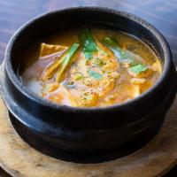 Korean Miso Stew · Our famous soybean paste stew with beef, tofu, calamari, and mussels.