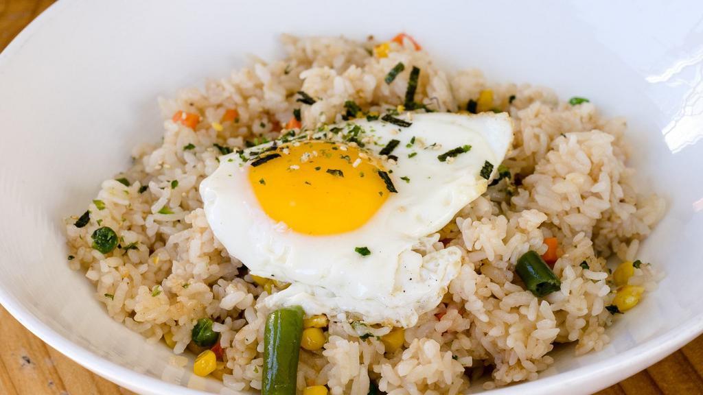 Fried Rice · Fried rice with choice of beef, chicken, bacon or tofu. Topped with a fried egg.
