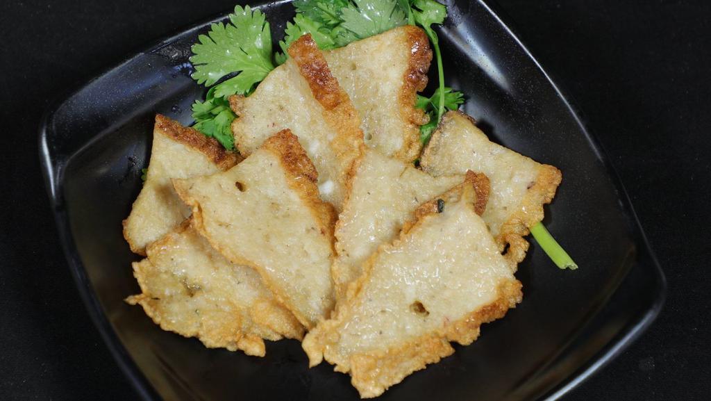 009. Pan-fried Fish Cake 煎魚餅 · 