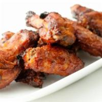 BBQ Chicken Wings · Pub-style BBQ wings with our double fry method.