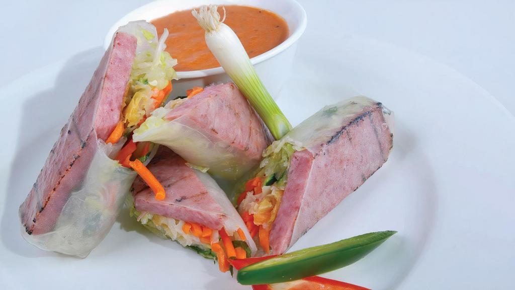 4. Nem Cuon - Roasted Pork Spring Rolls · Broiled pork wrapped in rice paper with fresh herbs and vermicelli, served with Tay Ho ‘s signature sauce. 2 rolls included.
