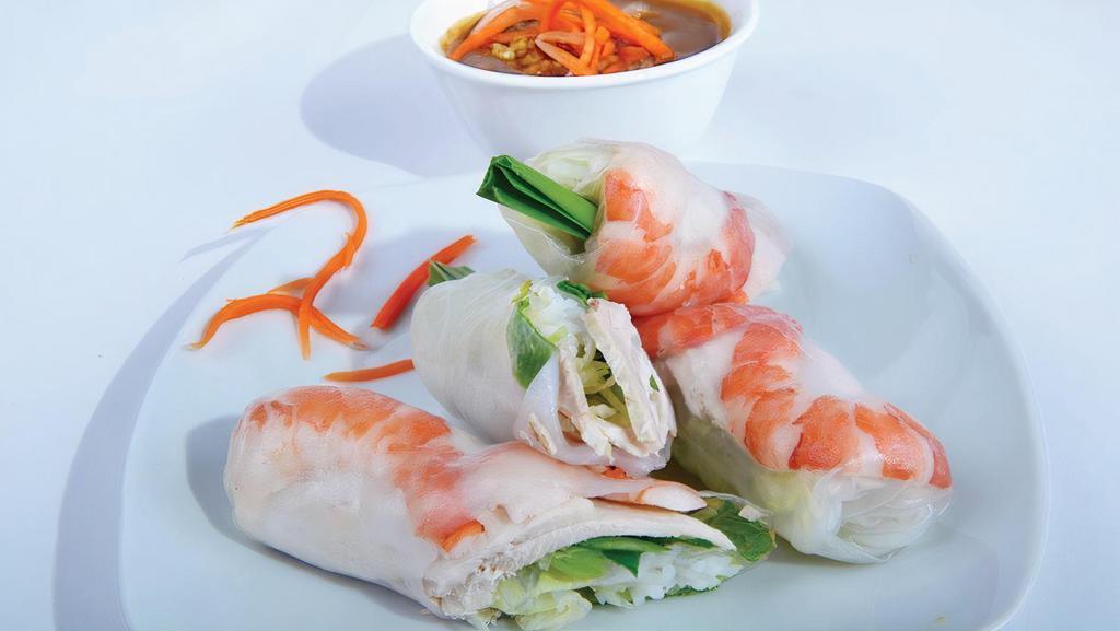 2. Goi Cuon - Fresh Shrimp Spring Rolls · Steamed shrimp and pork slices wrapped in rice paper with fresh herbs and rice noodles, served with peanut sauce. 2 rolls included.