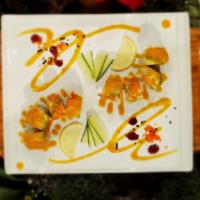 Mango Paradise Roll · Deep fried shrimp and cucumber topped with imitation crab, avocado, fresh mango, salmon and ...