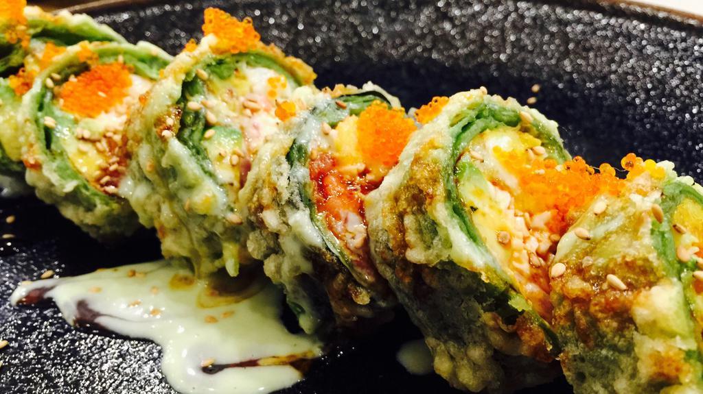 Titanic Roll · Imitation crab and avocado topped with tuna, salmon, imitation crab and unagi sauce.