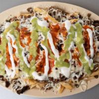 #8 Carne Asada Fries · Topped with choice of meat, sour cream, guacamole, cheese and enchilada sauce