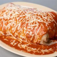 #7 Wet Burrito · Super burrito topped with enchilada sauce, cheese, sour cream and guacamole.
Inside of burri...