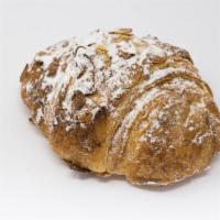 Croissant Amande · A Buttery, Flaky Croissant Filled with our Homemade Almond Paste, Topped With Sliced Almonds.
