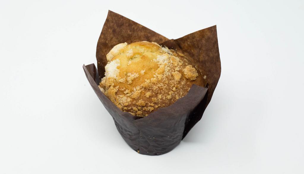 Blueberry Muffin · A Fluffy and Sweet Muffin with Fresh Blueberries Mixed in the Batter.