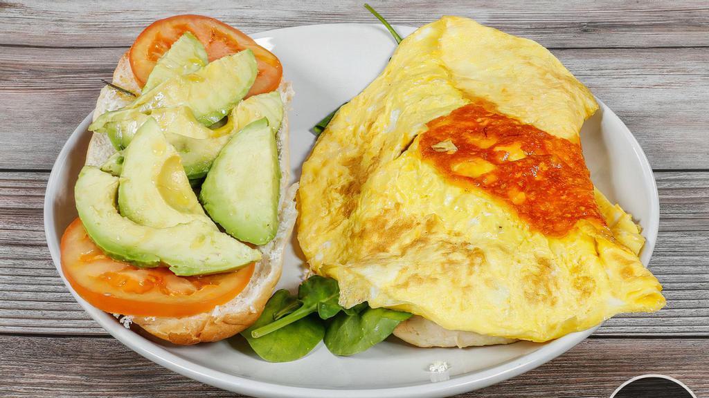 Breakfast Sandwich · Egg, cheese, avocado, tomato, mixed salad with hummus spread