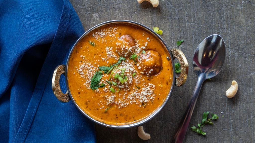 Malai Kofta · Vegetables and cheese patties cooked in creamy sauce.