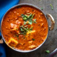 Paneer Tikka Masala · Tandoori paneer cooked in a rich ginger and garlic tomato sauce.