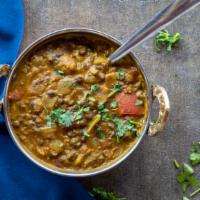 Dal Makhani · Whole black lentil simmered on a slow fire overnight and tempered with ginger, garlic and to...