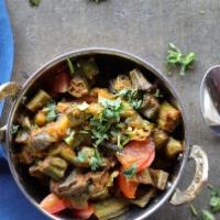 Bhendi Masala · Cut okra cooked with onions and tomatoes.