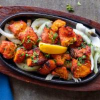 Fish Tikka · Grilled fish fillet flavored with tandoori masala, herbs, and spices.