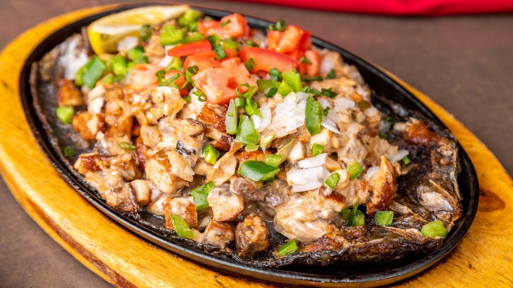 Bangus Sisig · Chopped milkfish, shallots, jalapeno topped with diced tomatoes in our special seasoning.