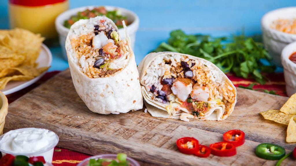 Veracruz Mahi-Mahi Burrito · Fresh Mahi-Mahi, Jack cheese, rice, Veracruz sauce, fresh salsa Mexicana, shredded cabbage, avocado and poblano crema. Wrapped artfully in a flour tortilla and grilled.