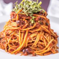 Spaghetti Puttanesca · Marinara sauce, anchovies, capers, garlic, and kalamata olives.