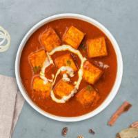 Paneer Tikka Masala · Fried cottage cheese cubes cooked with butter creamy sauce, onions and bell peppers.