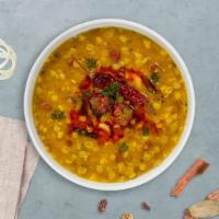 Andhra Dal · Yellow lentils and tomatoes cooked well with mild spices.