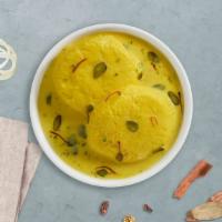 Ras Malai · Indian condensed cheese with flavored milk.
