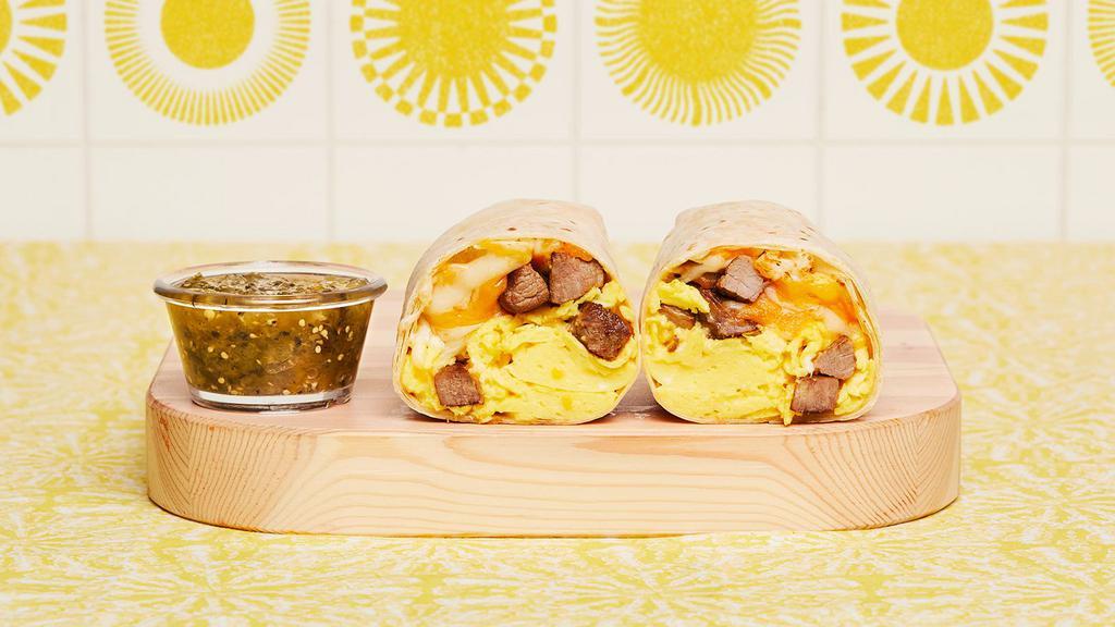 Steak Breakfast Burrito · Two scrambled eggs, breakfast potatoes, grilled steak, and melted cheese wrapped in a fresh flour tortilla.