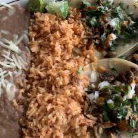 Taco Plate · Three Regular Tacos with Onions and Cilantro , (Choice of Meat) Rice and Beans