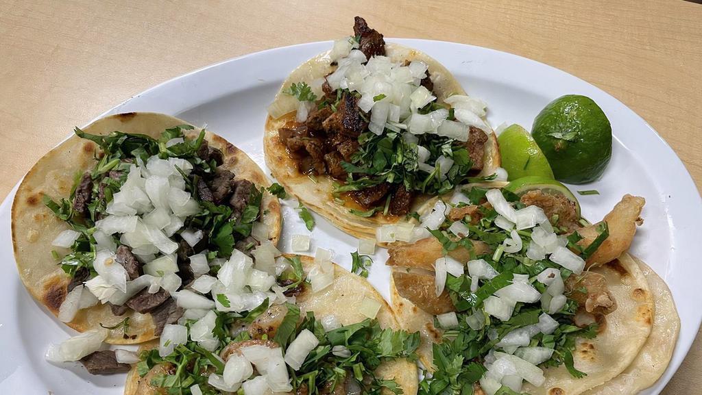 Regular Taco · Choice of Meat, Cilantro, and Onion.