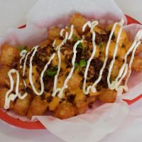 Loaded Tots · Tator tots topped with spicy chili, cheese, bacon and sour cream