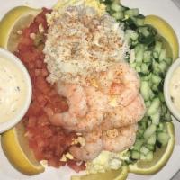 Crab & Shrimp Louie · Lump blue crab, shrimp, eggs, cucumbers, and tomatoes over iceburg lettuce and Louie dressin...