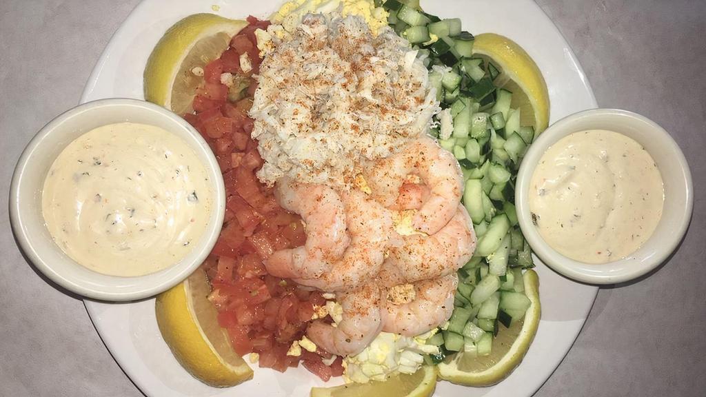 Crab & Shrimp Louie · Lump blue crab, shrimp, eggs, cucumbers, and tomatoes over iceburg lettuce and Louie dressing on the side