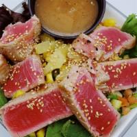 Seared Ahi Salad · Sliced, pan seared sashimi grade ahi, pineapple, cucumber, tomato, wonton strips and mango s...
