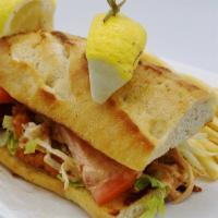 Seafood Po’ Boy · With fried Alaskan Pollock and fried shrimp on hoagie roll with lettuce, tomato and remoulad...