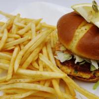 Crab Cake Sandwich · Maryland Style served on brioche bun with lettuce, tomato and remoulade sauce. Served with f...
